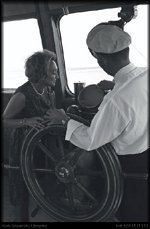 Florence Cooper, the wife of the owner of C. A. Pitts (Syd Cooper) on the bridge of the Flo. Cooper. Click to enlarge